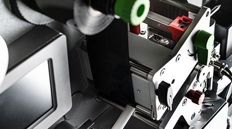 The labeling unit with ribbon first labels the wire tube.